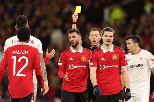 Mandatory Credit: Photo by Ryan Browne Shutterstock (13867464at) Referee Mr Felix Zwayer gives Bruno Fernandes of Manchester United, ManU a yellow card. Manchester United v Sevilla, UEFA Europa League, Quarter-Final, First Leg, Football, Old Trafford, Manchester, UK - 13 Apr 2023 Manchester United v Sevilla, UEFA Europa League, Quarter-Final, First Leg, Football, Old Trafford, Manchester, UK - 13 Apr 2023 Copyright: xRyanxBrowne Shutterstockx 13867464at