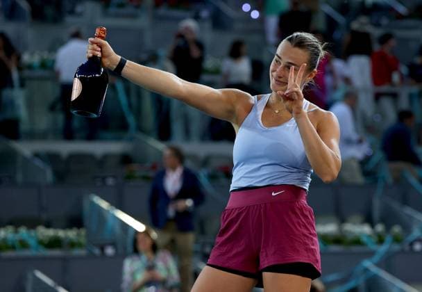 Mandatory Credit: Photo by Ella Ling Shutterstock (13895885a) Aryna Sabalenka of Belarus celebrates with a champagne bottle Mutua Madrid Open, Day 13, Tennis, La Caja Magica, Madrid, Spain - 06 May 2023 Mutua Madrid Open, Day 13, Tennis, La Caja Magica, Madrid, Spain - 06 May 2023 Copyright: xEllaxLing Shutterstockx 13895885a