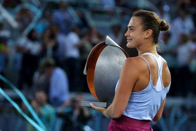 Mandatory Credit: Photo by Ella Ling Shutterstock (13895885c) Aryna Sabalenka of Belarus celebrates with the trophy under the blue streamer Mutua Madrid Open, Day 13, Tennis, La Caja Magica, Madrid, Spain - 06 May 2023 Mutua Madrid Open, Day 13, Tennis, La Caja Magica, Madrid, Spain - 06 May 2023 Copyright: xEllaxLing Shutterstockx 13895885c