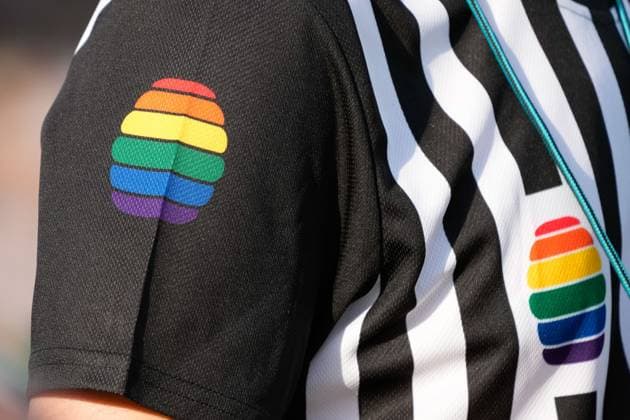 A referee, Referee, with the rainbow colors on the sleeve, colors of the rainbow as a symbol of tolerance and diversity, Armbadge, symbol photo, symbol image, symbol, 14 05 2023, Heidelberg Germany , Sport, EQC European Quidditch Championship, Final, Antwerp Quidditch Club Werewolves of London Firsts xozx