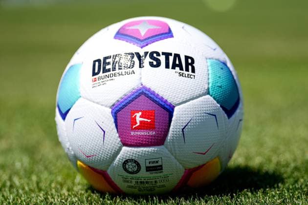 A Derbystar Bundesliga Brillant Aps by Select brand ball lies on the turf showing the Bundesliga logo, league, league logo, branding, DFL, official match ball of the 2023 24 season, official match ball, symbol photo, symbol image, symbol, 08 07 2023, Walldorf Germany , football, test match, FC Astoria Walldorf TSG 1899 Hoffenheim, 08 07 2023, Walldorf Germany , football, test match, FC Astoria Walldorf TSG 1899 Hoffenheim, DFB DFL REGULATES PROHIBIT ANY USE OF PHOTOGRAPHS AS IMAGE SEQUENCES AND OR QUASI VIDEO xozx