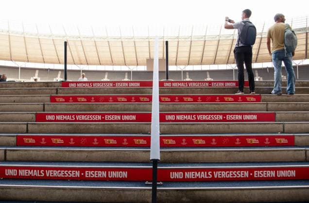 Football, men, season 2023 2024, Champions League Group C, 2 match day , 1 FC Union Berlin SC Braga, 1 day before the game, the Olympic Stadium is wrapped in the red and white club colors of Union, in the picture lettering on the stairs to the interior, 02 10 2023, Copyright: xSebastianxRäppold MatthiasxKochx
