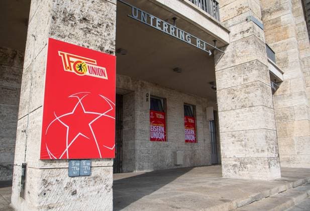 Football, men, season 2023 2024, Champions League Group C, 2 match day , 1 FC Union Berlin SC Braga, 1 day before the game, the Olympic Stadium is wrapped in the red and white club colors of Union, in the picture signs at the entrance to the East Curve, 02 10 2023, Copyright: xSebastianxRäppold MatthiasxKochx