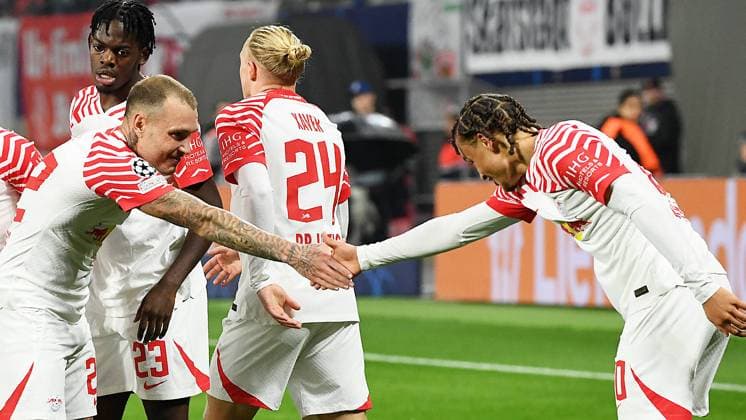 Soccer UEFA Champions League, 2023 2024 season, Group stage, Group G, Matchday 3, RB Leipzig vs Red Star Belgrade Sportsko drustvo Crvena zvezda 3 1 1 0 25 10 2023 Goalscorer David Raum Left back RB Leipzig, back number 22, 22 center left scores the 1 0 during the match RB Leipzig vs Red Star Belgrade Sportsko drustvo Crvena zvezda 25 10 2023 and cheers with Xavi Simons Offensive midfield RB Leipzig, Back number 20, 20 r Both shake hands to celebrate the goal Castello Lukeba Central defender RB Leipzig, back number 23, 23 , Xaver Schlager Central midfield RB Leipzig, back number 24, 24 v l n r watch to Leipzig Saxony Germany Red Bull Arena