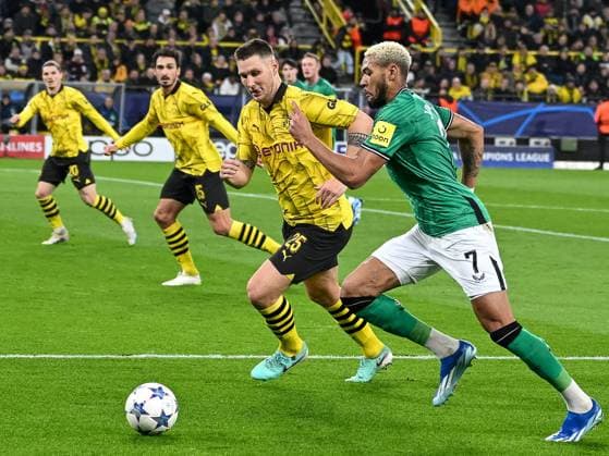 duel between Niklas Suele Borussia Dortmund 09, 25 and Joelinton Newcastle United, 07 Behind them Marcel Sabitzer Borussia Dortmund 09, 20 and Mats Hummels Borussia Dortmund 09, 15 secure Borussia Dortmund vs Newcastle United, Football, UEFA Champions League, Matchday 04, 2023 2024 season, 07 11 2023 Borussia Dortmund vs Newcastle United, Football, UEFA Champions League, Matchday 04, 2023 2024 season, 0307 11 2023 Dortmund Copyright: xEibner-Pressefoto ThomasxHaeslerx EP_THR