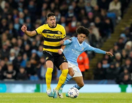 Manchester, England, 7th November 2023. Rico Lewis of Manchester City with Filip Ugrinic of Young Boys during the UEFA Champions League, Group G match at the Etihad Stadium, Manchester. Picture credit should read: Andrew Yates Sportimage EDITORIAL USE ONLY. No use with unauthorised audio, video, data, fixture lists, club league logos or live services. Online in-match use limited to 120 images, no video emulation. No use in betting, games or single club league player publications. SPI-2717-0020