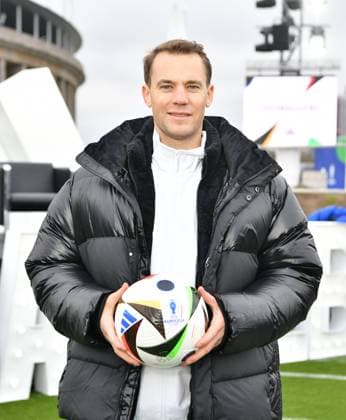 (231115) -- BERLIN, Nov. 15, 2023 -- Manuel Neuer, goalkeeper of German men s national football team, shows an official match ball of UEFA EURO, EM, Europameisterschaft,Fussball 2024 during the unveiling event of the official match ball of UEFA EURO 2024 in Berlin, Germany, Nov. 15, 2023. ) (SP)GERMANY-BERLIN-FOOTBALL-EURO 2024-OFFICIAL MATCH BALL-UNVEILING RenxPengfei
