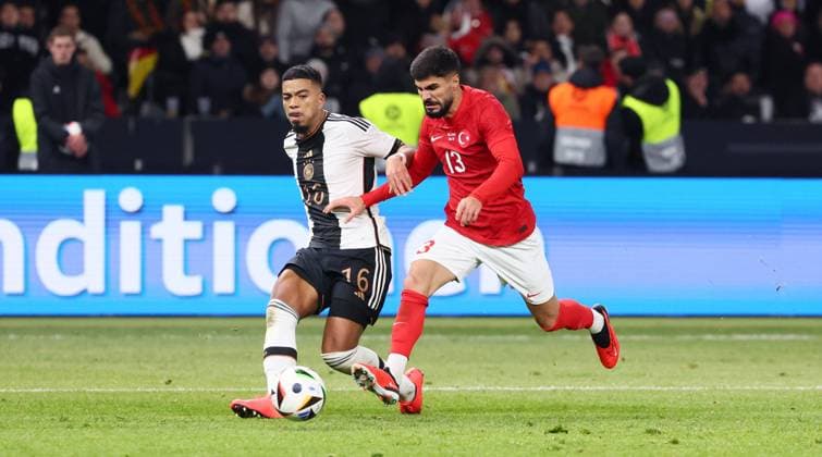 Germany Turkey 18 11 2023 Berlin, 18 11 2023, Soccer, Olympiastadion, International match , Germany GER vs Turkey TUR , In the picture from left Benjamin Henrichs 16, D , Eren Elmali 13, TUR , For editorial use only , According to the regulations of the DFB German Football Association, it is prohibited to use or have used photographs taken in the stadium and or from the match in the form of sequential images and or video-like photo series,
