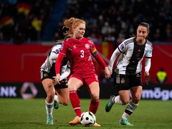 Stine Ballisager Denmark, 03 in duel with Sara Däbritz Germany, 13 , GER, Germany GER vs Denmark DEN , UEFA Womens Football Nations League, Liga A, Matchday 5, 01 12 2023 DFB DFL regulations prohibit any use of photographs as image sequences and or quasi video GER, Germany GER vs Denmark DEN , UEFA Womens Football Nations League, Liga A, Matchday 5, 01 12 2023 Rostock Copyright: xEibner-Pressefoto Memmlerx EP_MMR