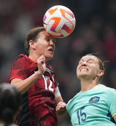 December 5, 2023, VANCOUVER, BC, CANADA: Canada s Christine Sinclair, left, gets her head on the ball in front of Australia s Clare Hunt to assist on a goal by teammate Quinn, not seen, during the first half of an International Friendly, Länderspiel, Nationalmannschaft soccer match, in Vancouver, on Tuesday, December 5, 2023. Canada News - December 5, 2023 - ZUMAc35_ 20231205_zaf_c35_126 Copyright: xDarrylxDyckx