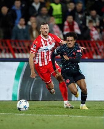 Oscar Bobb of Manchester City on the ball Crvena zvezda v Manchester City, UEFA Champions League, Group G, Football, Rajko Mitic Stadium, Belgrade, Serbia - 13 Dec 2023 EDITORIAL USE ONLY No use with unauthorised audio, video, data, fixture lists, club league logos or live services. Online in-match use limited to 120 images, no video emulation. No use in betting, games or single club league player publications. Copyright: xNikolaxKrstic Shutterstockx 14254230ba