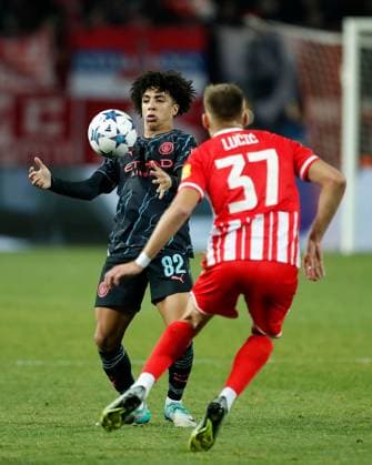 Rico Lewis of Manchester City controls the ball whilst being pressured by Vladimir Lucic of Red Star Crvena zvezda v Manchester City, UEFA Champions League, Group G, Football, Rajko Mitic Stadium, Belgrade, Serbia - 13 Dec 2023 EDITORIAL USE ONLY No use with unauthorised audio, video, data, fixture lists, club league logos or live services. Online in-match use limited to 120 images, no video emulation. No use in betting, games or single club league player publications. Copyright: xNikolaxKrstic Shutterstockx 14254230cu