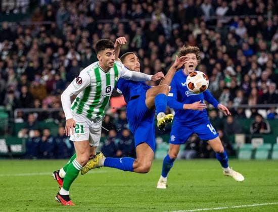 Rangers Forward Cyriel Dessers stretches for the ball during the Europa League Group C match at the Estadio Benito Villamarin, Seville. Real Betis v Rangers, UEFA Europa League, Group C, Football, Benito VillamaroÆ?Ã?Ân Stadium, Seville, Spain - 14 Dec 2023 EDITORIAL USE ONLY No use with unauthorised audio, video, data, fixture lists, club league logos or live services. Online in-match use limited to 120 images, no video emulation. No use in betting, games or single club league player publications. Copyright: xKirkxO Rourke RangersxFC Shutterstockx 14257803dd