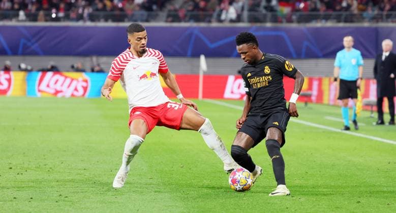 RB Leipzig Real Madrid Champions League Leipzig, 13 02 2024, Red Bull Arena, Football, UEFA Champions League, Round of 16 , RB Leipzig vs Real Madrid , In the picture from left Benjamin Henrichs 39, RB Leipzig , Vinicius Junior 7, Real , Only editorial use , UEFA regulations prohibit any use of photographs as image sequences and or quasi video ,