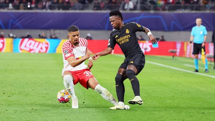 RB Leipzig Real Madrid Champions League Leipzig, 13 02 2024, Red Bull Arena, Football, UEFA Champions League, Round of 16 , RB Leipzig vs Real Madrid , In the picture from left Benjamin Henrichs 39, RB Leipzig , Vinicius Junior 7, Real , Only editorial use , UEFA regulations prohibit any use of photographs as image sequences and or quasi video ,