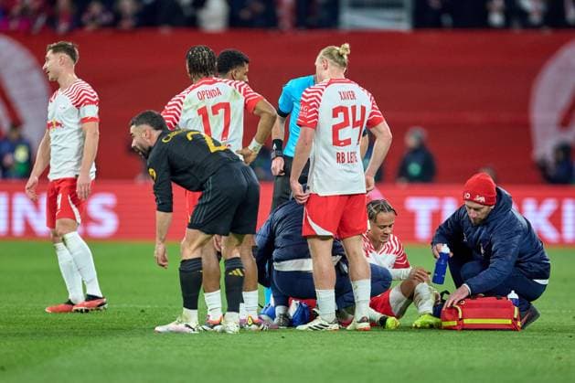 13 02 2024, Football, Men, Champions League, Round of 16, 2023 2024, First leg, RB Leipzig Real Madrid Xavi Simons 20, RB Leipzig , treatment, after foul, on ground Leipzig Red Bull Arena Saxony Germany