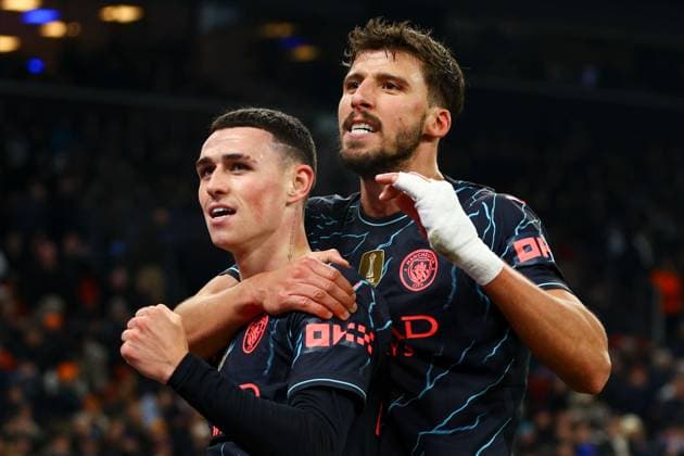 Phil Foden of Manchester City celebrates with Ruben Dias of Manchester City after scoring for their side to make it 3-1 FC Copenhagen v Manchester City, UEFA Champions League, Round of 16, First Leg, Football, Parken Stadium, Copenhagen, Denmark - 13 Feb 2024 EDITORIAL USE ONLY No use with unauthorised audio, video, data, fixture lists, club league logos or live services. Online in-match use limited to 120 images, no video emulation. No use in betting, games or single club league player publications. Copyright: xKieranxMcManus Shutterstockx 14343227dn