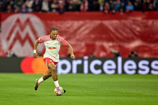 13 02 2024, Football, Men, Champions League, Round of 16, 2023 2024, First leg, RB Leipzig Real Madrid Lois Openda 17, RB Leipzig , free kick, action, with Bal, in dribbling, priceless band, Messe M Leipzig Red Bull Arena Saxony Germany