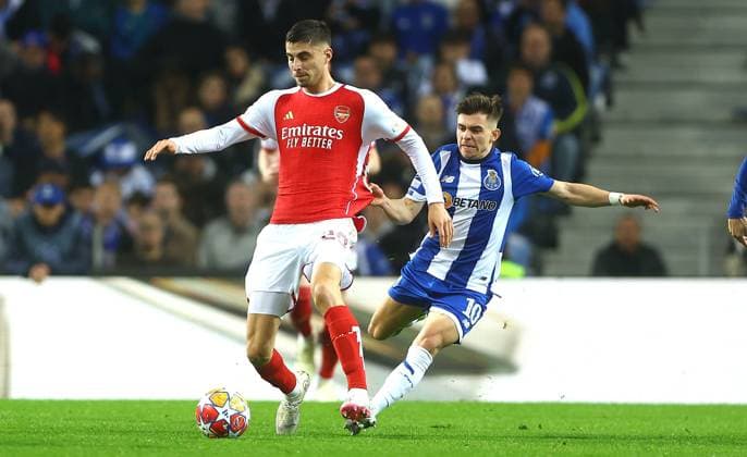 Kai Havertz of Arsenal is fouled by Francisco Conceicao of Porto Porto v Arsenal, UEFA Champions League, Round of 16, First Leg, Football, Estadio do Dragao, Porto, Portugal - 21 Feb 2024 EDITORIAL USE ONLY No use with unauthorised audio, video, data, fixture lists, club league logos or live services. Online in-match use limited to 120 images, no video emulation. No use in betting, games or single club league player publications. Copyright: xKieranxMcManus Shutterstockx 14355127x