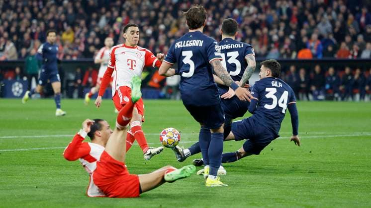 Picture Mario Gila Lazio Rome, 34 r throws himself into a shot by Jamal Musiala FC Bayern Muenchen, 42 05 03 2024, Football, Champions League, Round of 16, Bayern Muenchen Lazio Rome, GER, Muenchen, Allianz Arena, DFL REGULATIONS PROHIBIT ANY USE OF PHOTOGRAPHS AS IMAGE SEQUENCES AND OR QUASI VIDEO Copyright: HMBxMedia xHeikoxBecker