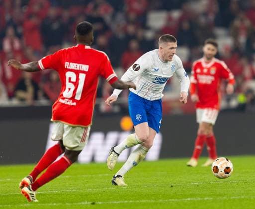 John Lundstram of Rangers on the ball during the Europa League Round of 16 Match at the Estadio da Luz, Lisbon. Benfica v Rangers, UEFA Europa League, Round of 16, First Leg, Football, Estadio da Luz, Lisbon, Portugal - 07 Mar 2024 EDITORIAL USE ONLY No use with unauthorised audio, video, data, fixture lists, club league logos or live services. Online in-match use limited to 120 images, no video emulation. No use in betting, games or single club league player publications. Copyright: xLukexNickerson RangersxFC Shutterstockx 14380036gm