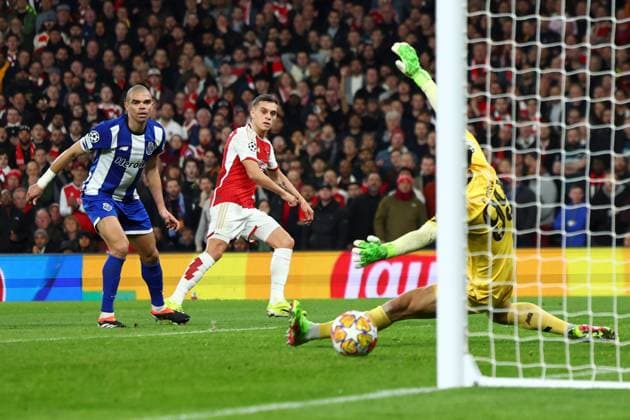 Leandro Trossard of Arsenal scoring a goal (1-0) Arsenal v Porto, UEFA Champions League, Round of 16, Second Leg, Football, Emirates Stadium, London, UK - 12 Mar 2024 EDITORIAL USE ONLY No use with unauthorised audio, video, data, fixture lists, club league logos or live services. Online in-match use limited to 120 images, no video emulation. No use in betting, games or single club league player publications. Copyright: xSimonxDael Shutterstockx 14384999n