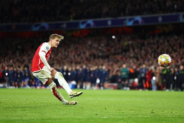 Martin Odegaard of Arsenal scores his sides first penalty Arsenal v Porto, UEFA Champions League, Round of 16, Second Leg, Football, Emirates Stadium, London, UK - 12 Mar 2024 EDITORIAL USE ONLY No use with unauthorised audio, video, data, fixture lists, club league logos or live services. Online in-match use limited to 120 images, no video emulation. No use in betting, games or single club league player publications. Copyright: xSimonxDael Shutterstockx 14384999ao