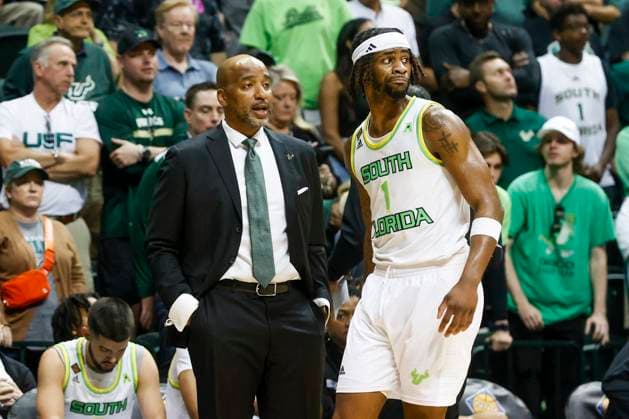 March 24, 2024, Tampa, Florida, USA: South Florida Bulls head coach Amir Abdur-Rahim, left, and guard Selton Miguel (1), right, share a moment before his free-throw in the second half of a first round NIT game against the Virginia Commonwealth Rams at USF s Yuengling Center in Tampa on Sunday, March 24, 2024. Tampa USA - ZUMAs70_ 0442135745st Copyright: xIvyxCeballox