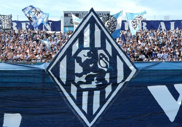 Munich, Germany 06 April 2024 Football, Men, 3 Liga, Season 2023 2024, TSV 1860 München FC Viktoria Köln, Grünwalder Stadion A choreo, choreography, logo, crest, fan, fans, atmosphere, flag, flags in the West Curve, TSV 1860 München Fans DFB regulations prohibit any use of photographs as image sequences and or quasi video