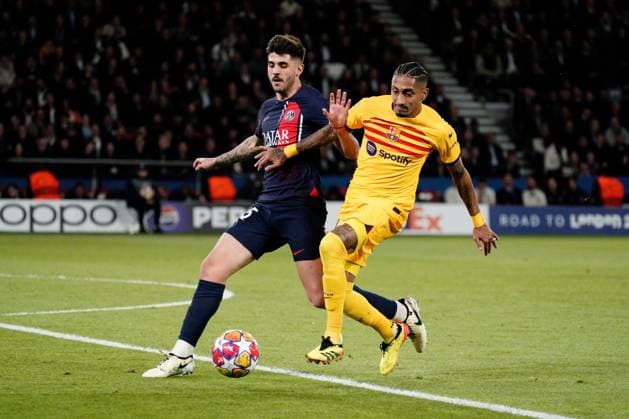 Raphinha of Barcelona takes on Lucas Beraldo of PSG Paris Saint-Germain v Barcelona, UEFA Champions League, Quarter Final, First Leg, Football, Parc des Princes, Paris, France - 10 Apr 2024 EDITORIAL USE ONLY No use with unauthorised audio, video, data, fixture lists, club league logos or live services. Online in-match use limited to 120 images, no video emulation. No use in betting, games or single club league player publications. Copyright: xDavexWinter Shutterstockx 14424874al