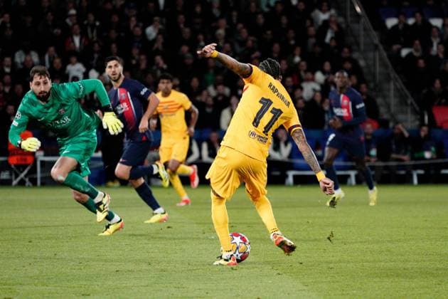 Raphinha of Barcelona puts his side 1-0 ahead Paris Saint-Germain v Barcelona, UEFA Champions League, Quarter Final, First Leg, Football, Parc des Princes, Paris, France - 10 Apr 2024 EDITORIAL USE ONLY No use with unauthorised audio, video, data, fixture lists, club league logos or live services. Online in-match use limited to 120 images, no video emulation. No use in betting, games or single club league player publications. Copyright: xDavexWinter Shutterstockx 14424874ao