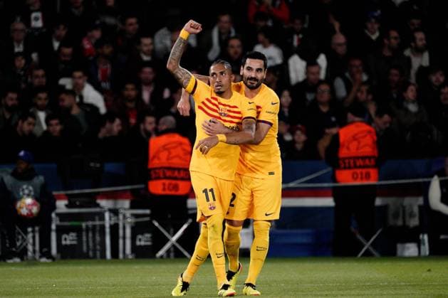 Raphinha of Barcelona is congratulated by Ilkay Gundogan of Barcelona after he puts his side 1-0 ahead Paris Saint-Germain v Barcelona, UEFA Champions League, Quarter Final, First Leg, Football, Parc des Princes, Paris, France - 10 Apr 2024 EDITORIAL USE ONLY No use with unauthorised audio, video, data, fixture lists, club league logos or live services. Online in-match use limited to 120 images, no video emulation. No use in betting, games or single club league player publications. Copyright: xDavexWinter Shutterstockx 14424874as