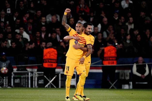 Raphinha of Barcelona is congratulated by Ilkay Gundogan of Barcelona after he puts his side 1-0 ahead Paris Saint-Germain v Barcelona, UEFA Champions League, Quarter Final, First Leg, Football, Parc des Princes, Paris, France - 10 Apr 2024 EDITORIAL USE ONLY No use with unauthorised audio, video, data, fixture lists, club league logos or live services. Online in-match use limited to 120 images, no video emulation. No use in betting, games or single club league player publications. Copyright: xDavexWinter Shutterstockx 14424874au