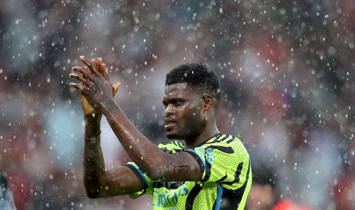 Thomas Partey of Arsenal applauds the fans Manchester United, ManU v Arsenal, Premier League, Football, Old Trafford, Manchester, UK - 12 May 2024 EDITORIAL USE ONLY No use with unauthorised audio, video, data, fixture lists, club league logos or live services. Online in-match use limited to 120 images, no video emulation. No use in betting, games or single club league player publications. Copyright: xMattxWest Shutterstockx 14474027bn