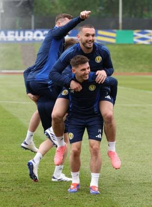 Billy Gilmour of Scotland gives John McGinn of Scotland a piggyback Scotland Training Session, UEFA European Championship, EM, Europameisterschaft 2024, Group A Football, Stadion am Groben, Garmisch-Partenkirchen, Germany, 13 Jun 2024 EDITORIAL USE ONLY No use with unauthorised audio, video, data, fixture lists, club league logos or live services. Online in-match use limited to 120 images, no video emulation. No use in betting, games or single club league player publications. Copyright: xPaulxCurrie Shutterstockx 14523767u