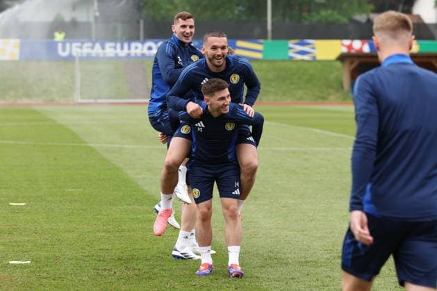 Billy Gilmour of Scotland gives John McGinn of Scotland a piggyback Scotland Training Session, UEFA European Championship, EM, Europameisterschaft 2024, Group A Football, Stadion am Groben, Garmisch-Partenkirchen, Germany, 13 Jun 2024 EDITORIAL USE ONLY No use with unauthorised audio, video, data, fixture lists, club league logos or live services. Online in-match use limited to 120 images, no video emulation. No use in betting, games or single club league player publications. Copyright: xPaulxCurrie Shutterstockx 14523767v