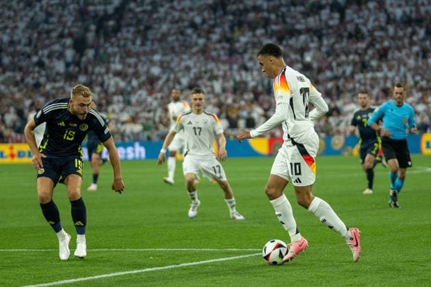 Tommy Conway Scotland 19 , Jamal Musiala Germany 10 , GER, Germany GER vs Scottland SCO , European Football Championship, UEFA EURO 2024, Group A, Matchday 1, 14 06 2024, GER, Germany GER vs Scottland SCO , European Football Championship, UEFA EURO 2024, Group A, Matchday 1, 14 06 2024 Munich Copyright: xEibner-Pressefoto SaschaxWaltherx EP_EER