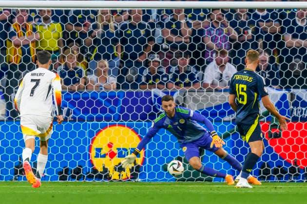 GER, UEFA Euro 2024, Group A, Germany GER vs Scotland SCO 14 06 2024, Allianz Arena, Munich, GER, UEFA Euro 2024, Group A, Germany GER vs Scotland SCO , in picture Goal for 1 0 by Florian Wirtz Germany 17 not in picture with Angus Gunn Scottland 1 Kai Havertz Germany 7 Ryan Porteous Scottland 15 nordphotoxGmbHx xStraubmeier nph00004