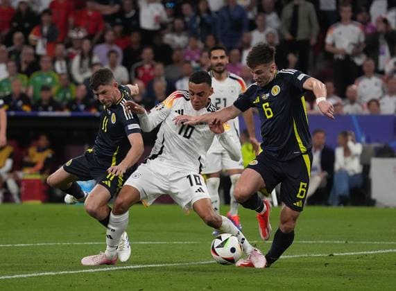 GER, EM UEFA 2024, Group A, Germany vs Scotland 14 06 2024, Allianz Arena, Munich, GER, EM UEFA 2024, Group A, Germany vs Scotland, pictured Ryan Christie Scottland 11 , Jamal Musiala Germany 10 , Kieran Tierney Scottland 6 nordphotoxGmbHx xBratic nph00250