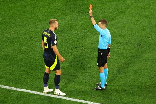 Ryan Porteous of Scotland receives a red card from Referee Clà ment Turpin after a reckless challenge on Ilkay Gündogan of Germany in the penalty area Germany v Scotland, UEFA European Championship, EM, Europameisterschaft 2024, Group A, Football, Munich Football Arena, Munich, Germany, 14 Jun 2024 EDITORIAL USE ONLY No use with unauthorised audio, video, data, fixture lists, club league logos or live services. Online in-match use limited to 120 images, no video emulation. No use in betting, games or single club league player publications. Copyright: xKieranxMcManus Shutterstockx 14523770bt