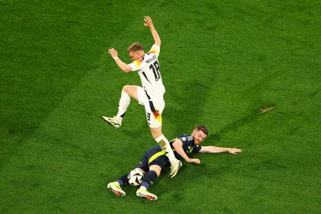 Maximilian Mittelstädt of Germany is challenged by Anthony Ralston of Scotland Germany v Scotland, UEFA European Championship, EM, Europameisterschaft 2024, Group A, Football, Munich Football Arena, Munich, Germany, 14 Jun 2024 EDITORIAL USE ONLY No use with unauthorised audio, video, data, fixture lists, club league logos or live services. Online in-match use limited to 120 images, no video emulation. No use in betting, games or single club league player publications. Copyright: xKieranxMcManus Shutterstockx 14523770dv
