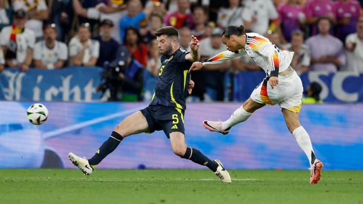 14 06 2024, Football, European Championship, Germany Scotland, GER, Munich, Munich Football Arena, picture from left Grant Hanley Scotland, 5 and Leroy Sane Germany, 19 , Copyright: HMBxMedia xHeikoxBecker
