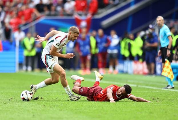 Dan Ndoye of Switzerland is challenged by Marton Dardai of Hungary Hungary v Switzerland, UEFA European Championship, EM, Europameisterschaft 2024, Group A, Football, Cologne Stadium, Cologne, Germany, 15 Jun 2024 EDITORIAL USE ONLY No use with unauthorised audio, video, data, fixture lists, club league logos or live services. Online in-match use limited to 120 images, no video emulation. No use in betting, games or single club league player publications. Copyright: xMichaelxZemanek Shutterstockx 14539265ca