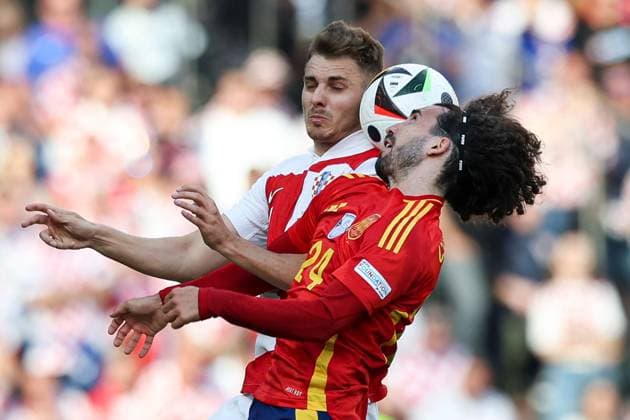 Marc Cucurella of Spain battles with Josip Stanisic of Croatia in the air Spain v Croatia, UEFA European Championship, EM, Europameisterschaft 2024, Group B, Football, Olympiastadion, Berlin, Germany, 15 Jun 2024 EDITORIAL USE ONLY No use with unauthorised audio, video, data, fixture lists, club league logos or live services. Online in-match use limited to 120 images, no video emulation. No use in betting, games or single club league player publications. Copyright: xMattxWest Shutterstockx 14539284z