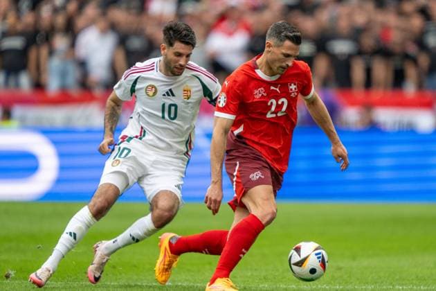 GER, EURO 2024, Group A, Hungary HUN vs Switzerland SUI 15 06 2024, Cologne Stadium, Cologne, GER, EURO 2024, Group A, Hungary HUN vs Switzerland SUI In the picture Fabian Schär Switzerland SUI, 22 ball on foot single action, full body full body cropping, single image, action, action, game scene in front of Dominik Szoboszlai Hungary HUN, 10 nordphotoxGmbHxx xDenkinger nph00015