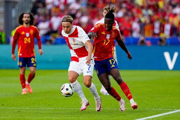 Nico Williams of Spain (R) battles with Lovro Majer of Croatia (L) Spain v Croatia, UEFA European Championship, EM, Europameisterschaft 2024, Group B, Football, Olympiastadion, Berlin, Germany, 15 Jun 2024 EDITORIAL USE ONLY No use with unauthorised audio, video, data, fixture lists, club league logos or live services. Online in-match use limited to 120 images, no video emulation. No use in betting, games or single club league player publications. Copyright: xDavexShopland Shutterstockx 14539285bh