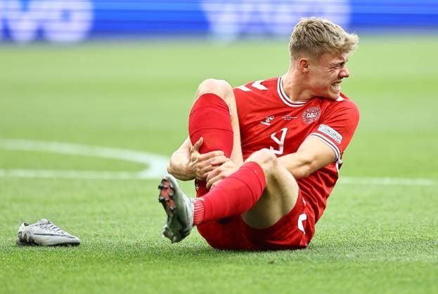 Rasmus Hojlund of Denmark holds his leg after a challenge where his boot fell off his foot Slovenia v Denmark, UEFA European Championship, EM, Europameisterschaft 2024, Group C, Football, Stuttgart Arena, Stuttgart, Germany, 16 Jun 2024 EDITORIAL USE ONLY No use with unauthorised audio, video, data, fixture lists, club league logos or live services. Online in-match use limited to 120 images, no video emulation. No use in betting, games or single club league player publications. Copyright: xMichaelxZemanek Shutterstockx 14539399ba