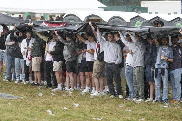A general view of England fans in the fan zone sheltering from the rain at Trabrennbahn, Gelsenkirchen, Germany Serbia v England, UEFA European Championship, EM, Europameisterschaft 2024, Group C, Football, Arena Aufschalke, Gelsenkirchen, Germany - 16 Jun 2024 EDITORIAL USE ONLY No use with unauthorised audio, video, data, fixture lists, club league logos or live services. Online in-match use limited to 120 images, no video emulation. No use in betting, games or single club league player publications. Copyright: xPaulxCurrie Shutterstockx 14541951ch
