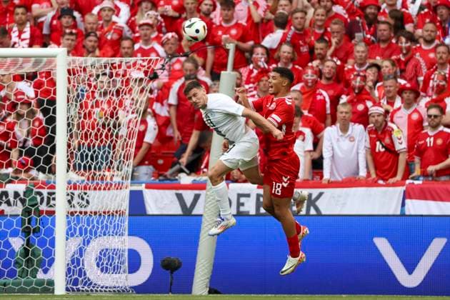 Erik Janza Slovenia, 13 and Alexander Bah Denmark, 18 in a header duel , Football, UEFA , European Championship, Group C 2024, Slovenia vs Denmark, 16 06 2024, Stuttgart Arena, Stuttgart, Germany Stuttgart Stuttgart Arena Baden Wuerttemberg Germany Copyright: xGrantxHubbsx