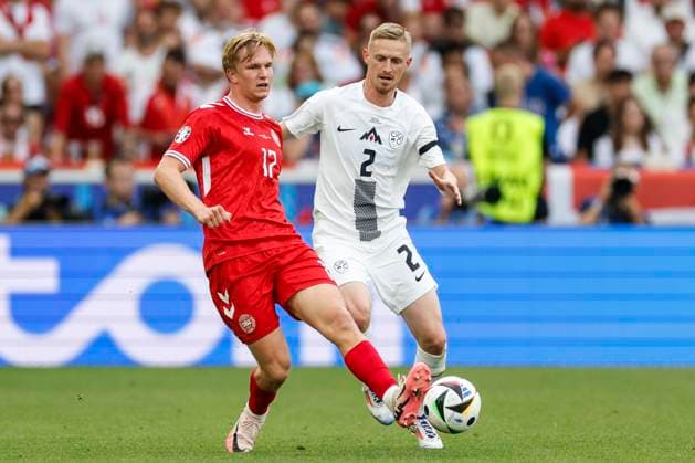 16 06 2024, Football, European Championship, Slovenia Denmark, GER, Stuttgart, Football Arena, picture from left Victor Kristiansen Denmark, 17 , Zan Karnicnik Slovenia, 2 , Action, duels, fighting for the ball, Copyright: HMBxMedia xHeikoxBecker
